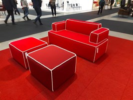 Red sofa with white lining Stockholm Furniture Fair 2025