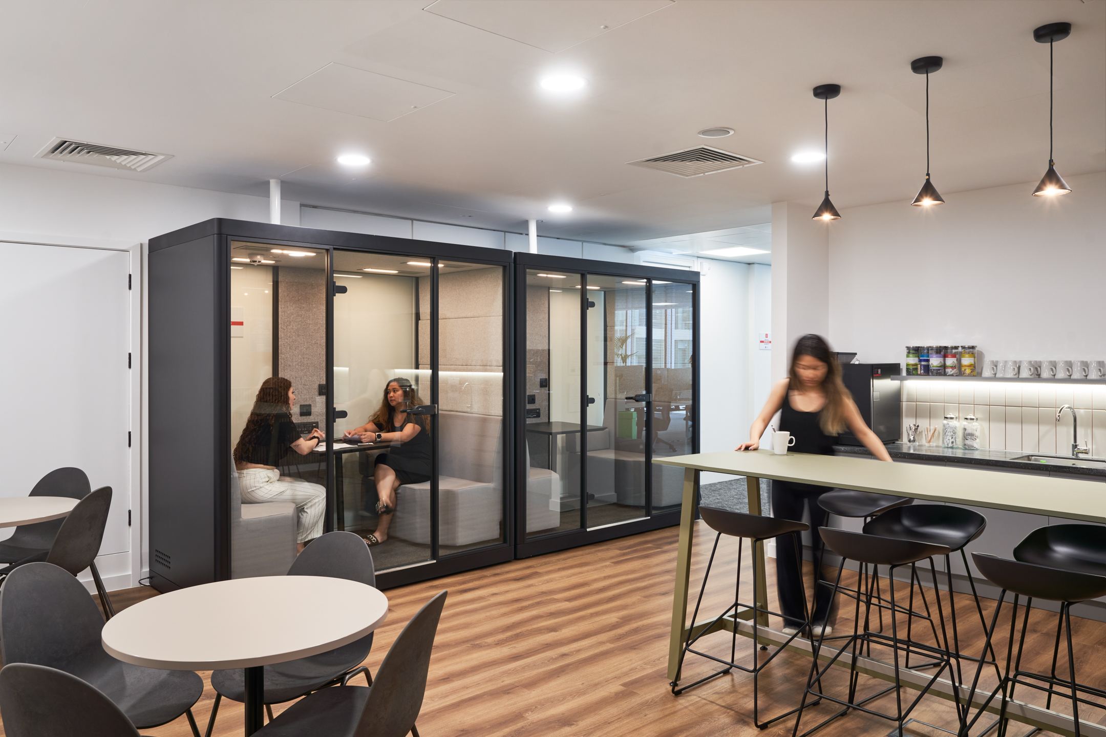 Flexible breakout area at LGC with acoustic meeting pods, café-style tables and bar seating, fully furnished by Platfform.