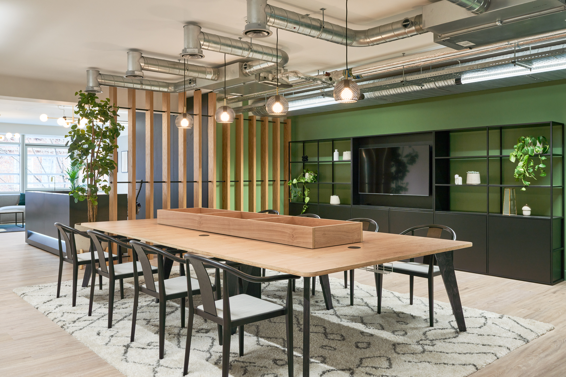 Collaborated office desk area at 101 New Cavendish St, L2, created by Platfform for the client, featuring shared bench-style desking with integrated power, ergonomic task chairs, and subtle zoning for team-based working.
