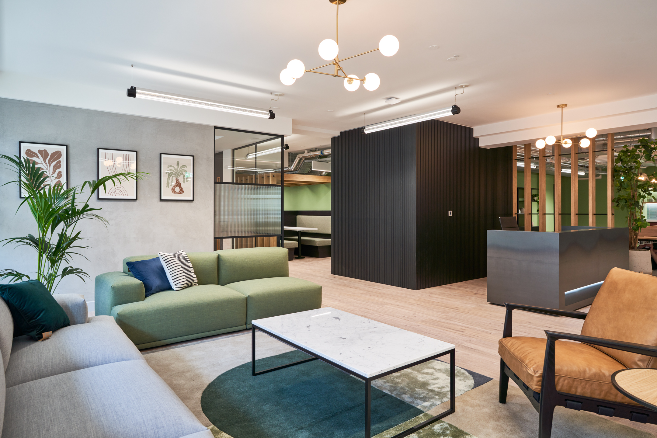 Breakout area within 101 New Cavendish St, L2, delivered by Platfform for the client, combining soft seating, informal meeting points, and muted tones to create a relaxed and functional communal space.