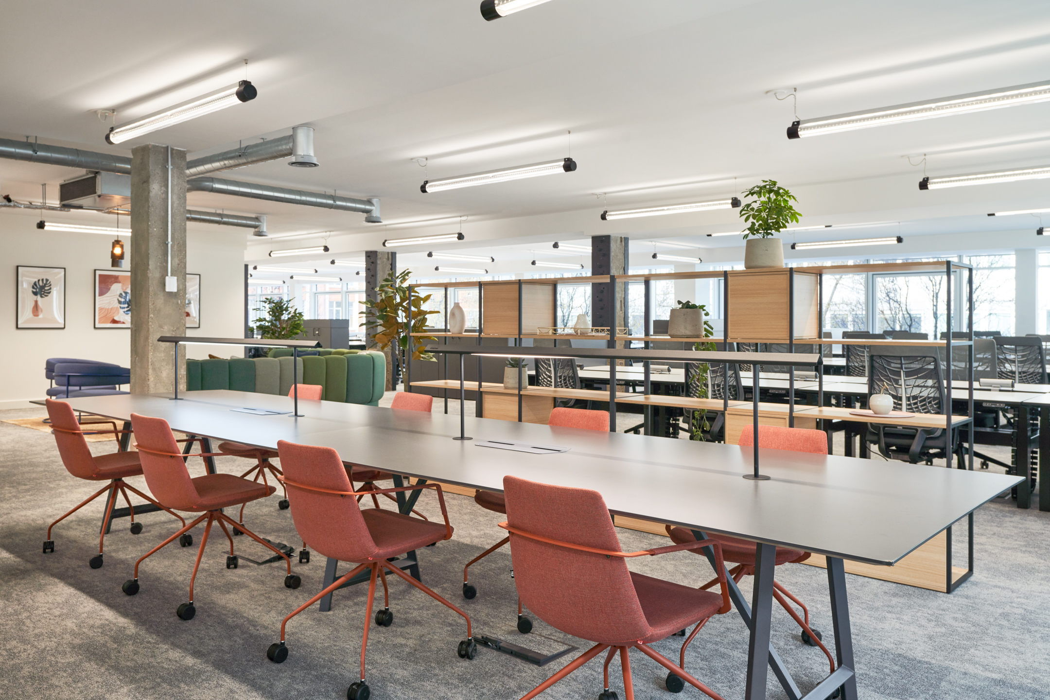 Collaborated office desk area at 101 New Cavendish St, L2, created by Platfform for the client, featuring shared bench-style desking with integrated power, ergonomic task chairs, and subtle zoning for team-based working.