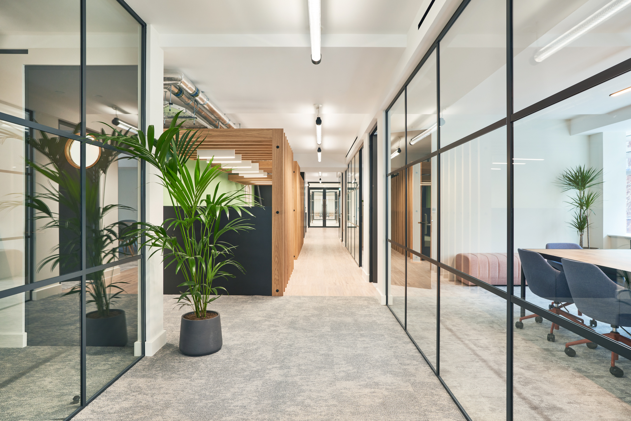 Corridor at 101 New Cavendish St, L2, part of Platfform’s fit-out for the client, with clear lines of sight, refined finishes, and seamless transitions into adjacent meeting and office spaces.