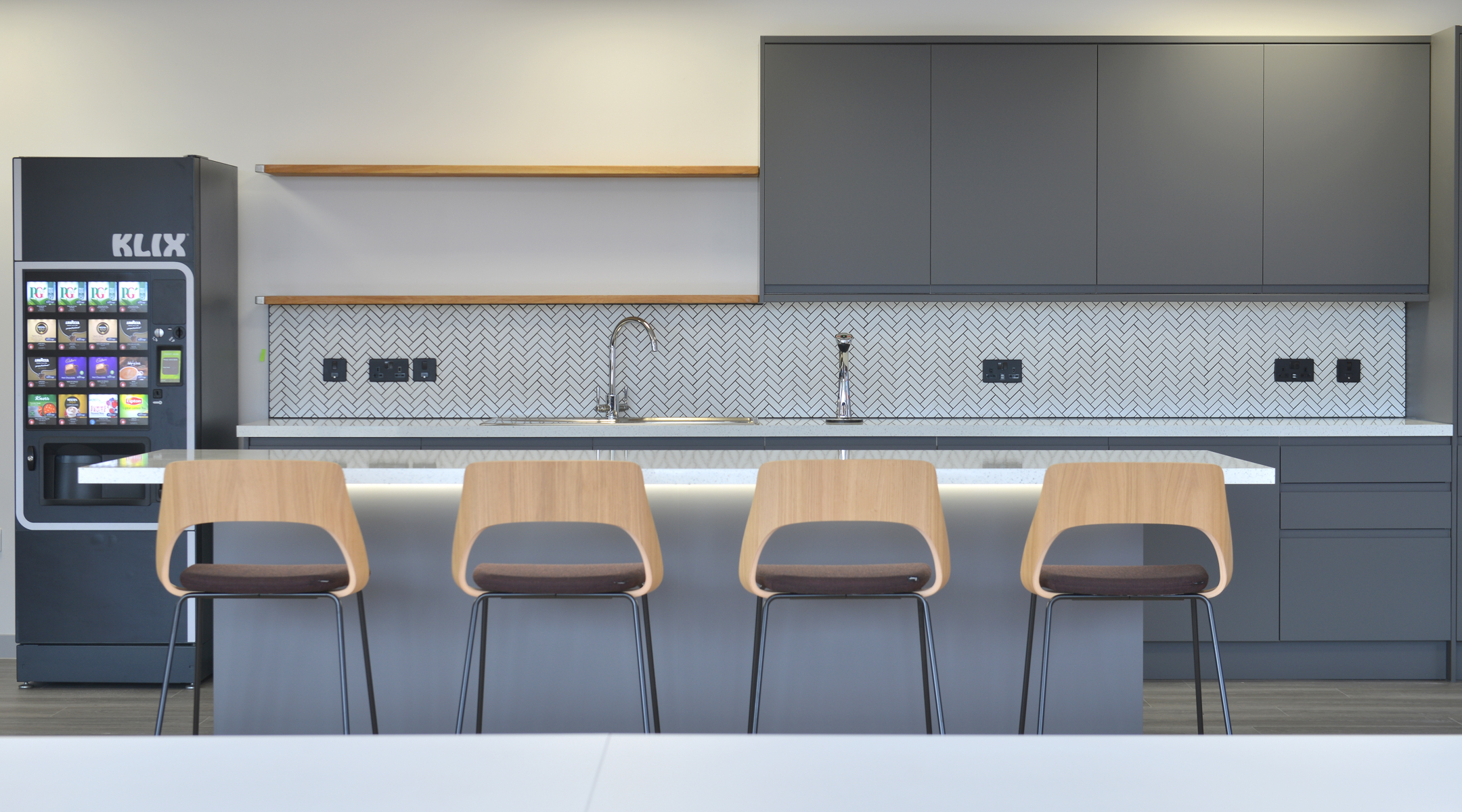 Teapoint seating area at Fujitsu Edinburgh, furnished with modern high stools