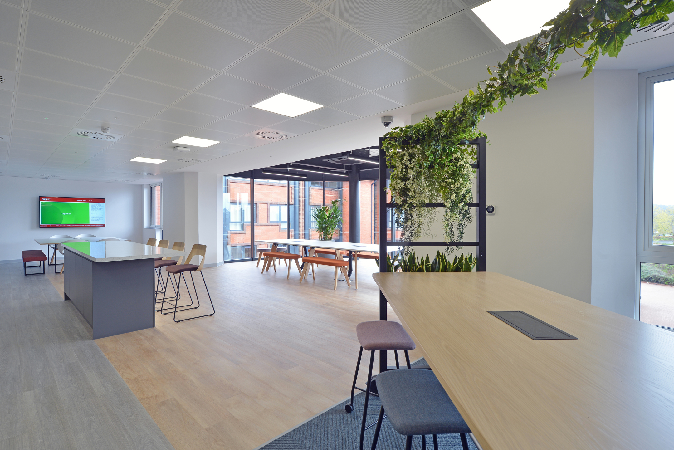 Teapoint and collaborative furniture supplied for Fujitsu Edinburgh, with integrated planting and a mix of seating styles