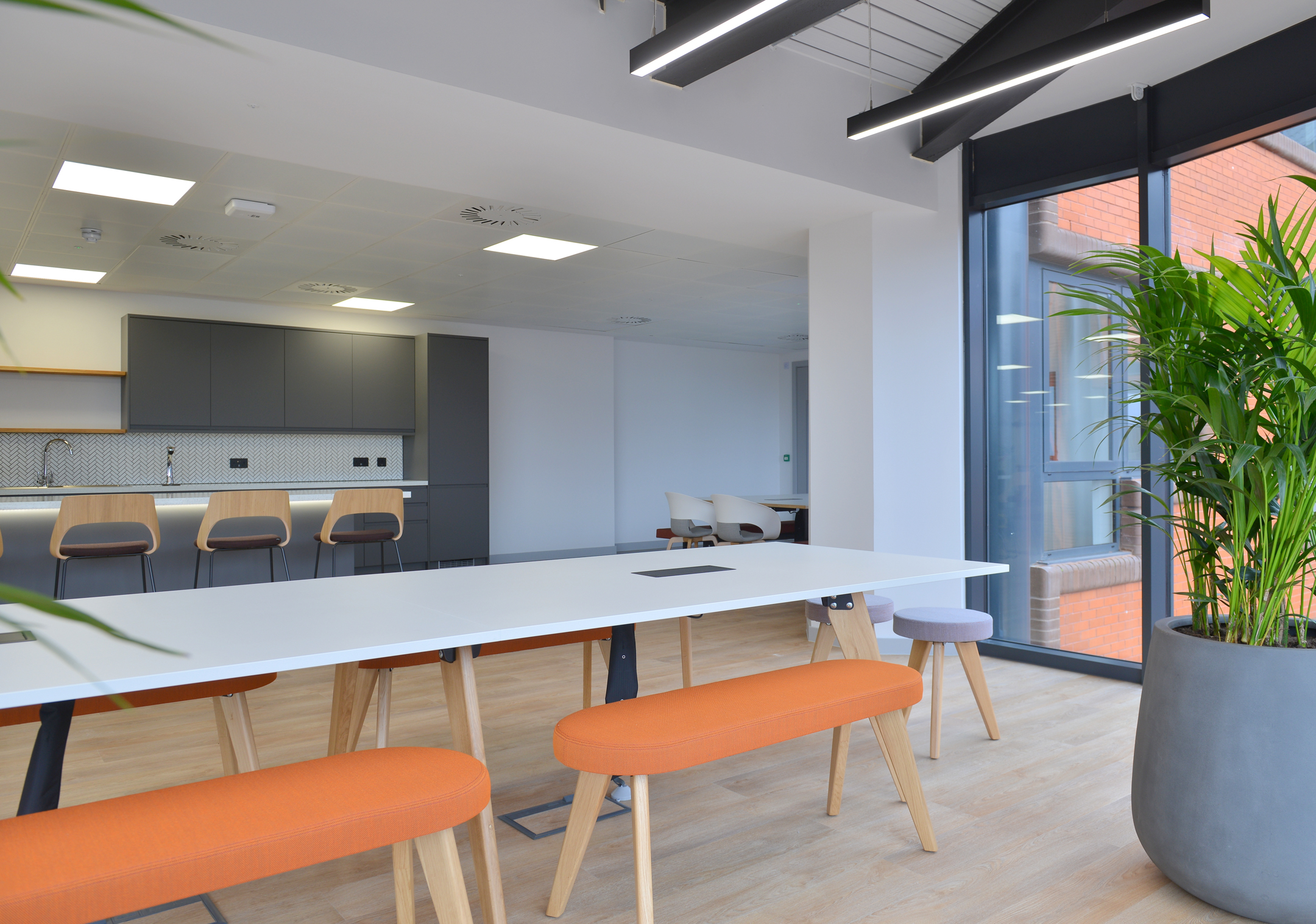 Furniture for Fujitsu Edinburgh’s teapoint and informal meeting area, featuring benches, stools and a high counter