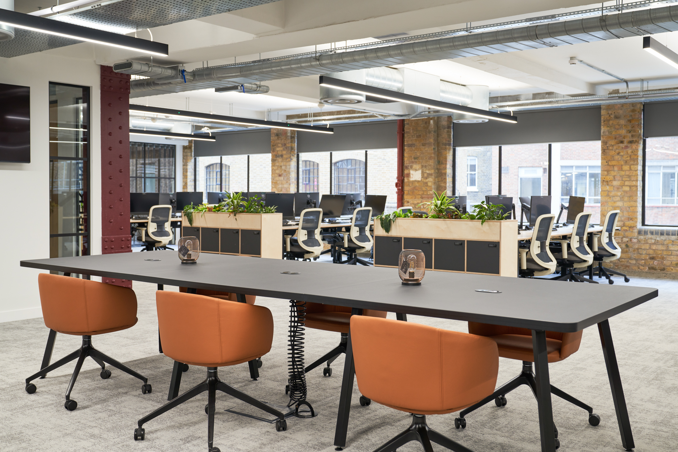 Open-plan workspace at Adyen with collaborative desks, ergonomic seating, and greenery throughout, all sourced and supplied by Platfform.