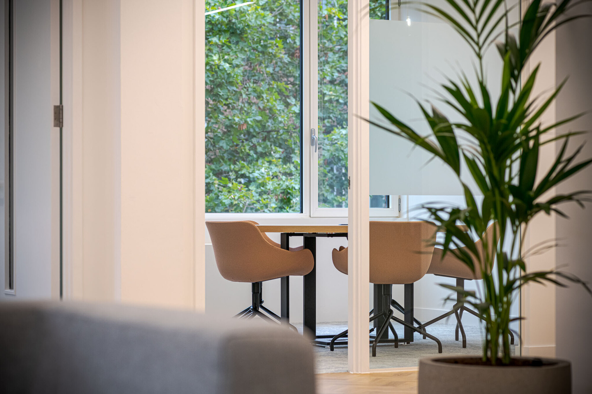 Casual office meeting area at Berry Street designed by Platfform, showcasing a creative space with unique pendant lighting and comfortable seating.