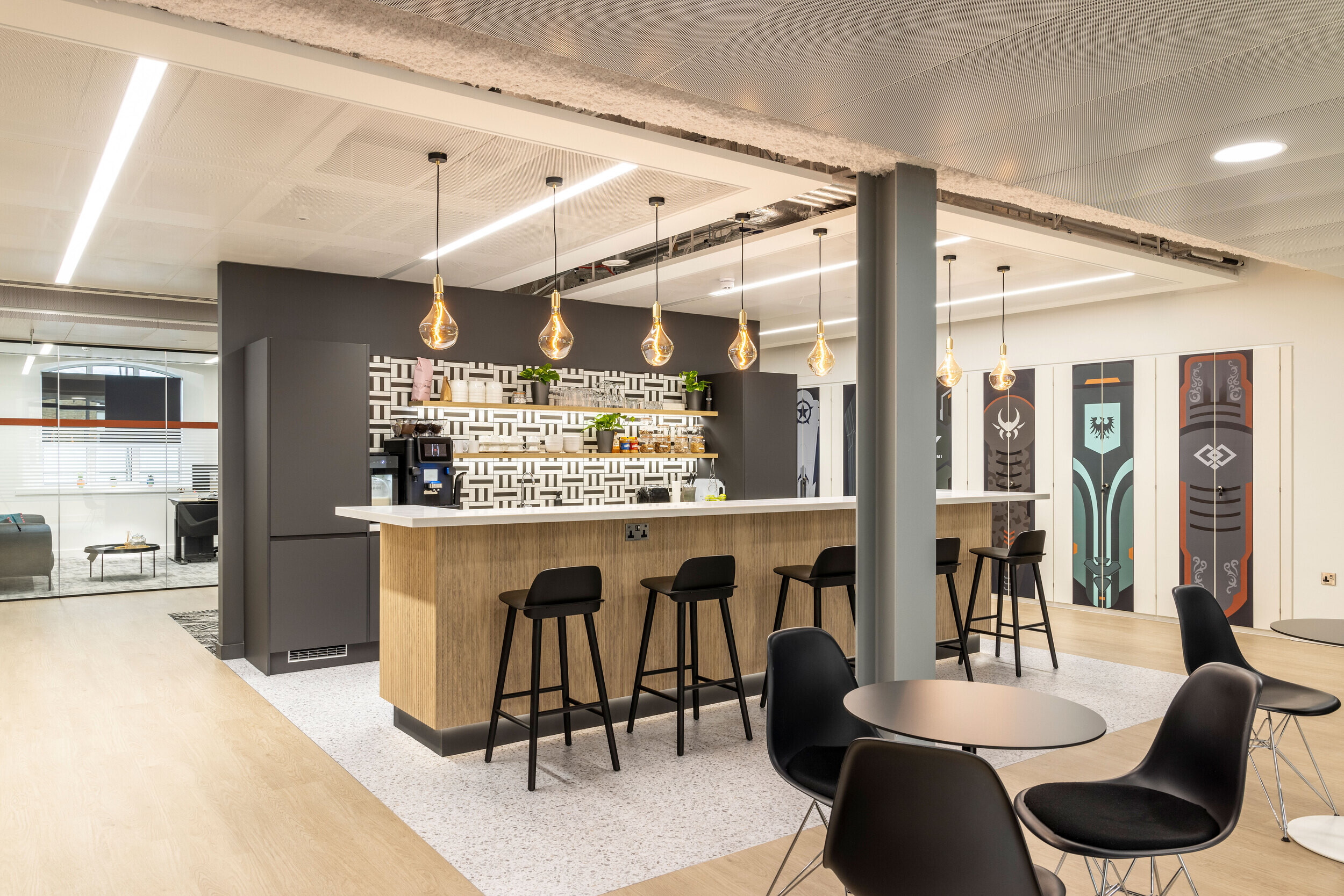 Spacious breakout area in CCP Games' office with furniture by Platfform, with a central teapoint, bar seating, and collaborative zones.