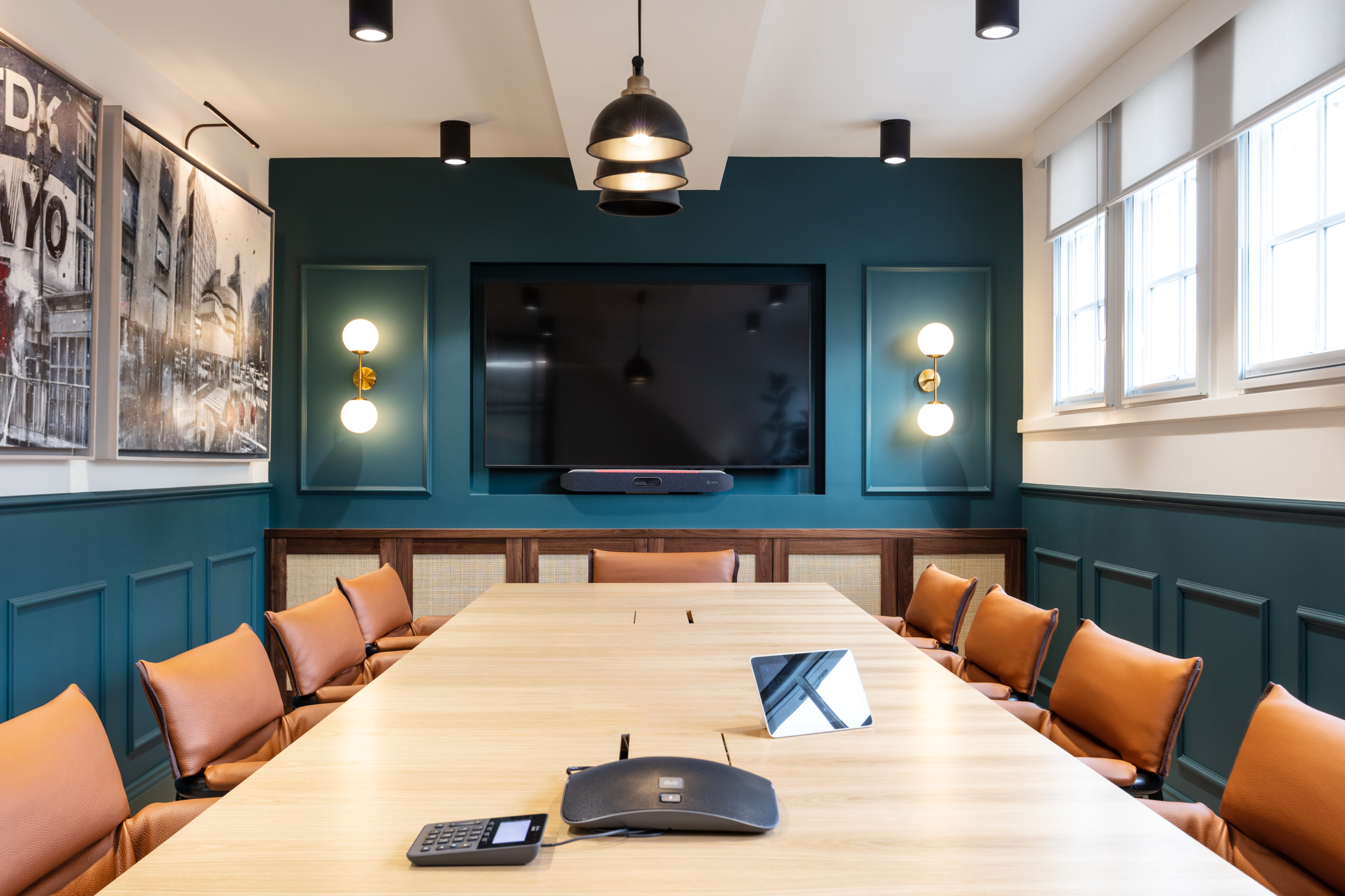 Boardroom designed for Cain International with warm-toned leather chairs and a bespoke conference table, with furniture consultancy by Platfform.