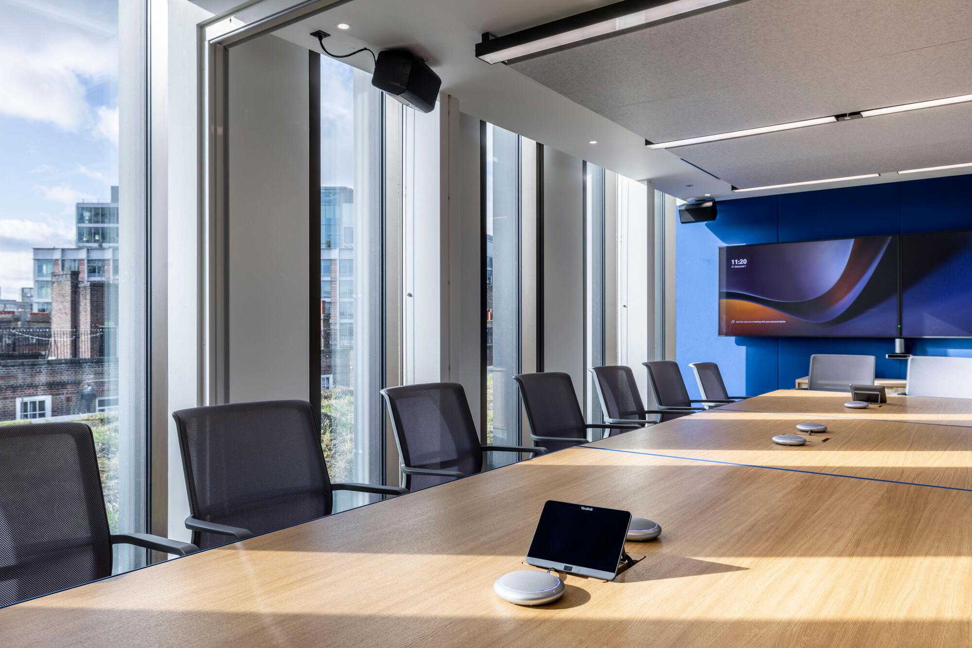 Boardroom at Carbon Clean with mesh task chairs and a large meeting table, furnished by Platfform to support hybrid collaboration.