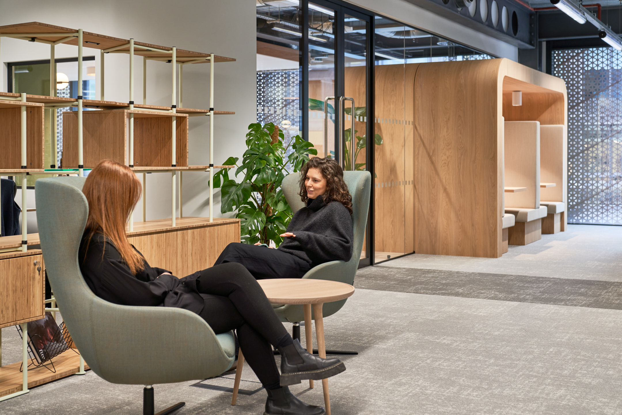 Relaxed lounge seating and modular shelving within a Financial Service office, furnished by Platfform to support informal meetings and agile working.