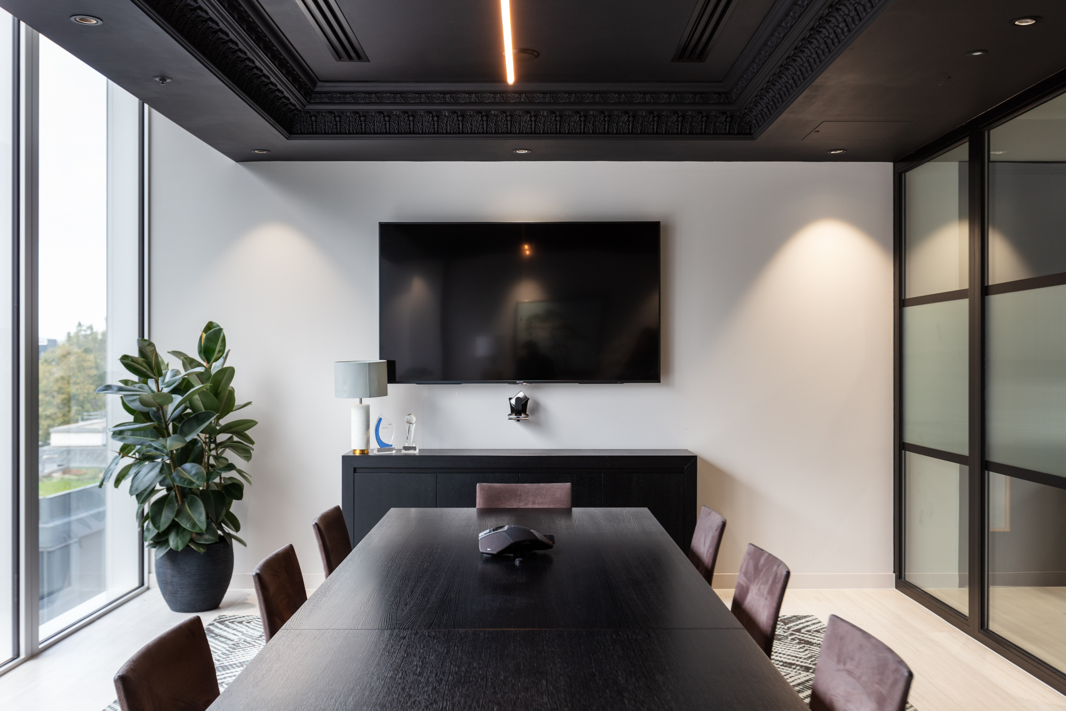 finnCap meeting room furnished with a dark timber boardroom table, modern chairs and sleek sideboard, all supplied by Platfform.