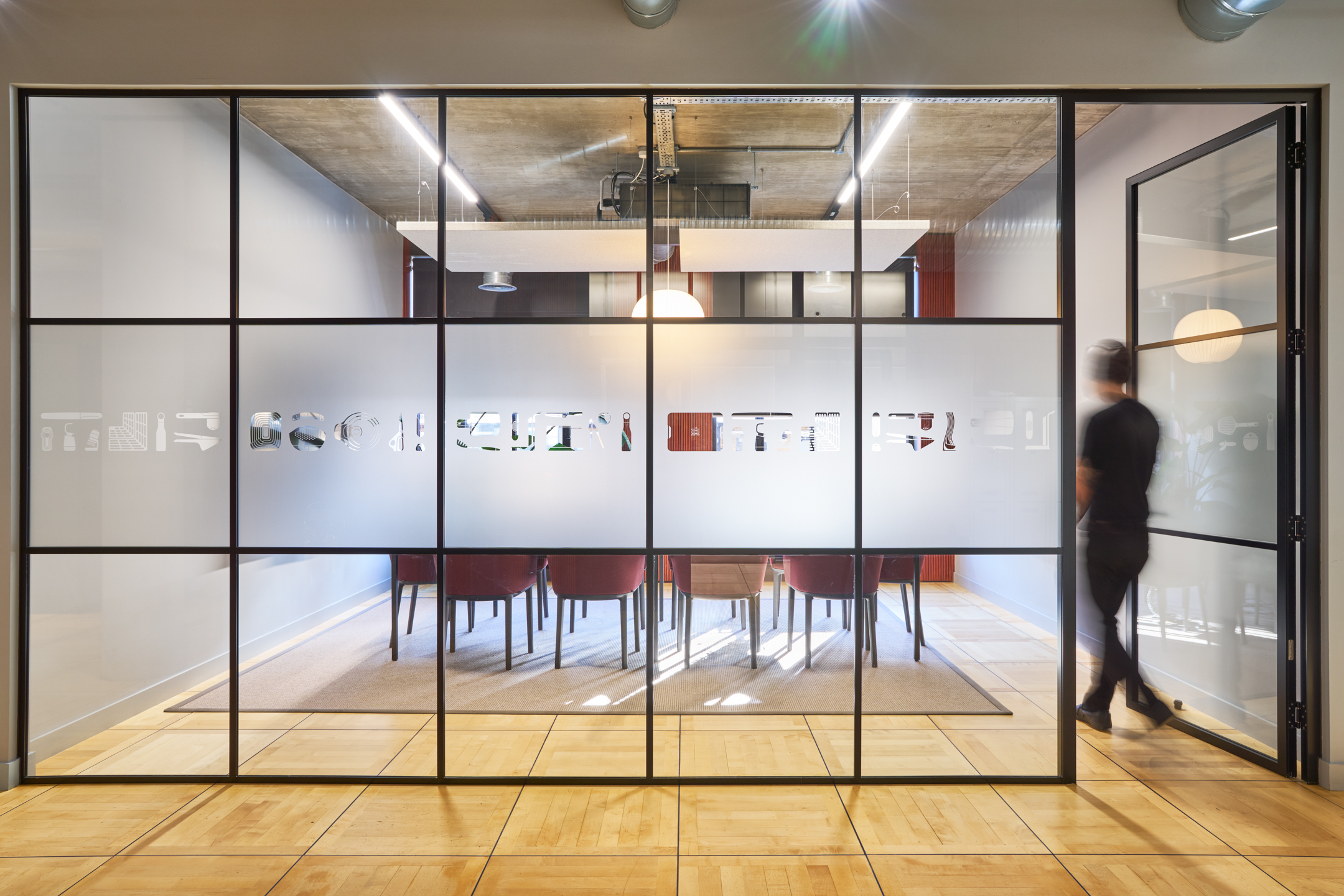 Bespoke manifestation on the glass walls of a meeting room at the Joseph Joseph office, blending transparency with privacy.