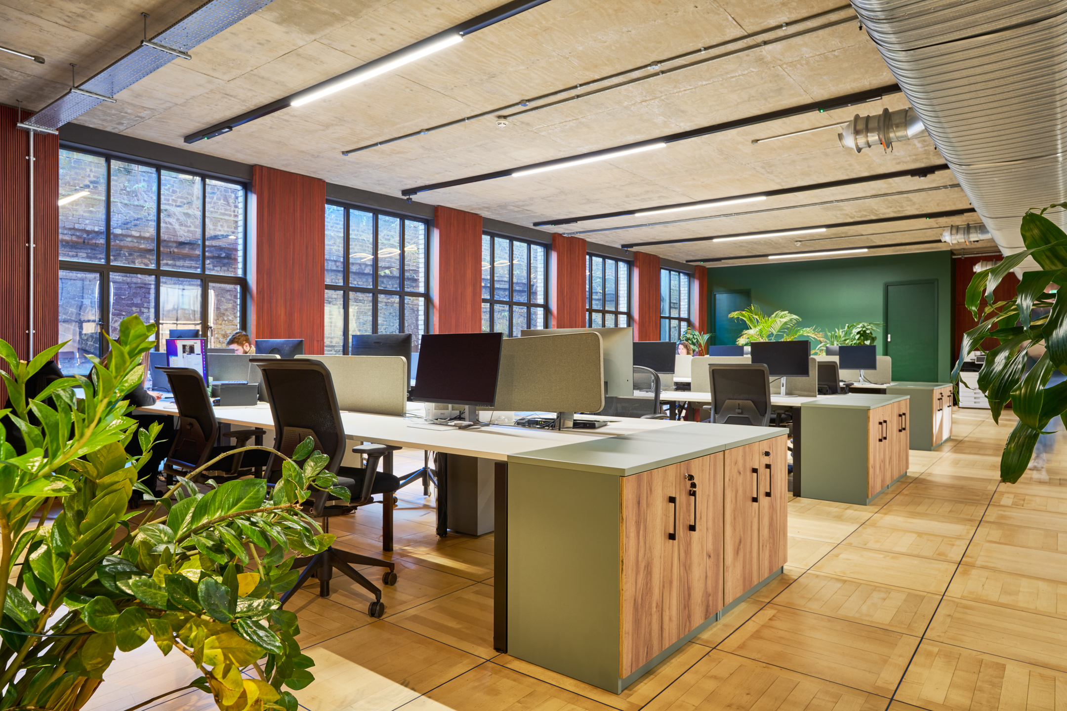 The open-plan workspace Joseph Joseph’s offices, furniture by Platfform, featuring modern desks, ergonomic chairs, and natural greenery for a collaborative environment.