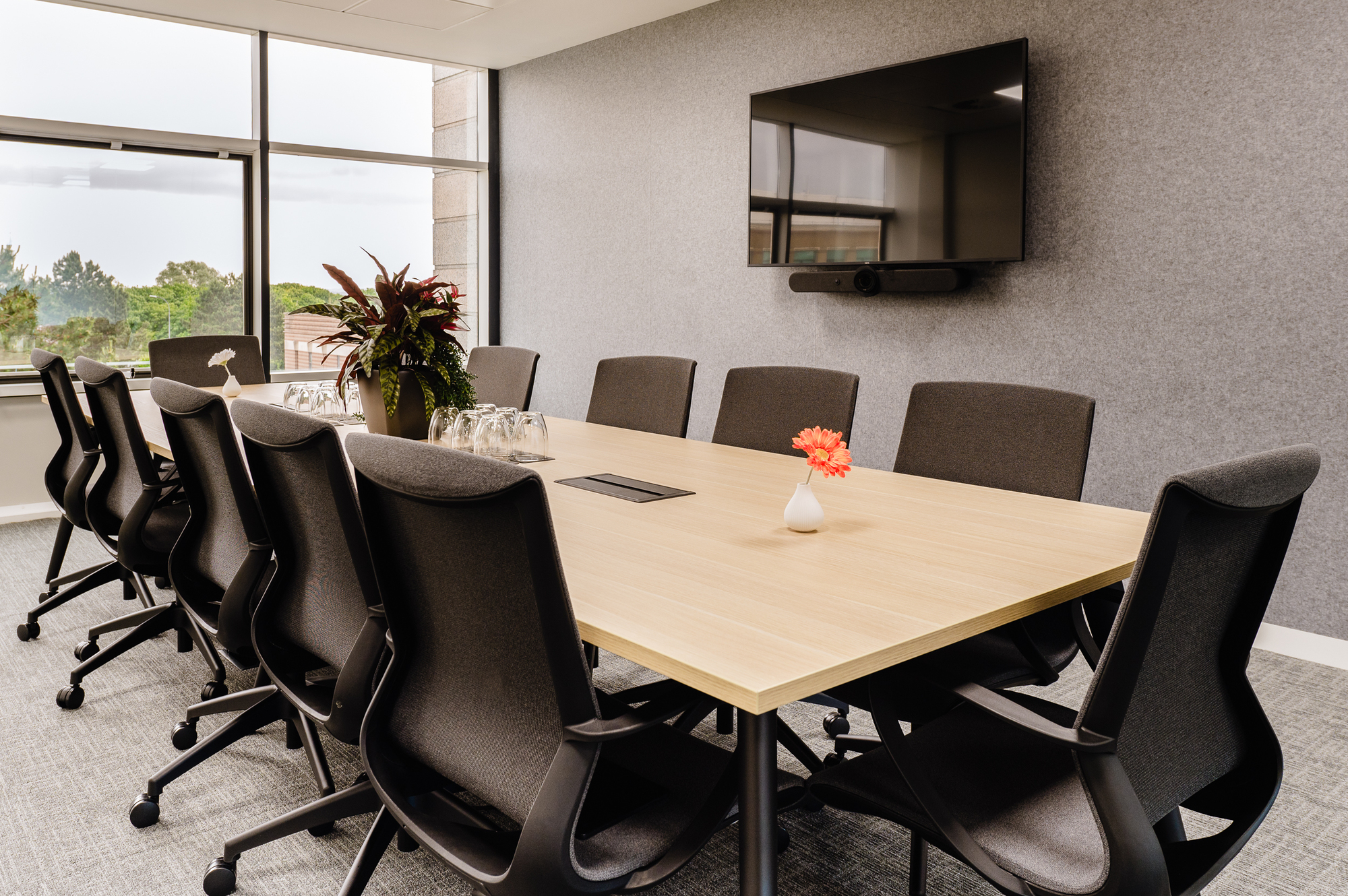 Bright meeting room at Serendipity Labs Bristol, furniture by Platfform, featuring ergonomic seating and a large window.