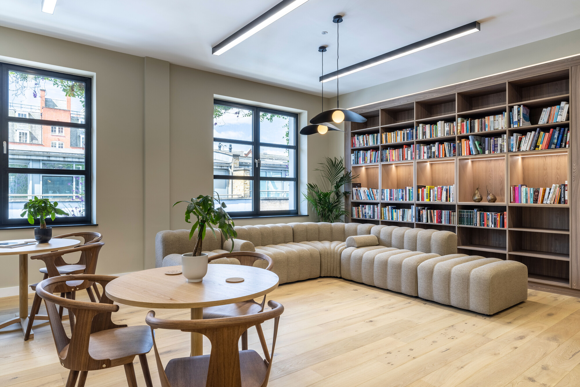 Transition's London workspace by Platfform, featuring bespoke shelving and Scandinavian-inspired furniture in a warm, eco-friendly lounge area