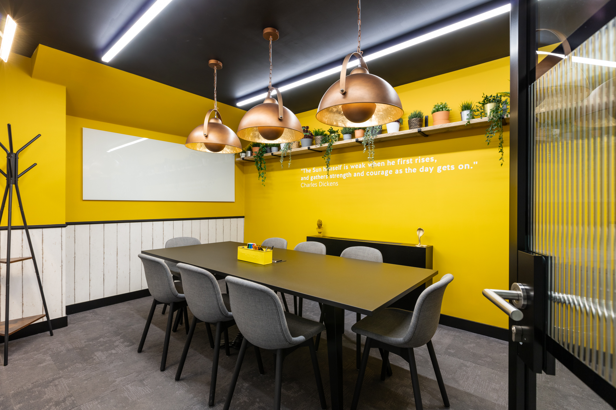 A bold and creative yellow meeting room at Work.life Red Lion Street, designed by Platfform to energise workspace users with pops of colour and inspiring décor.
