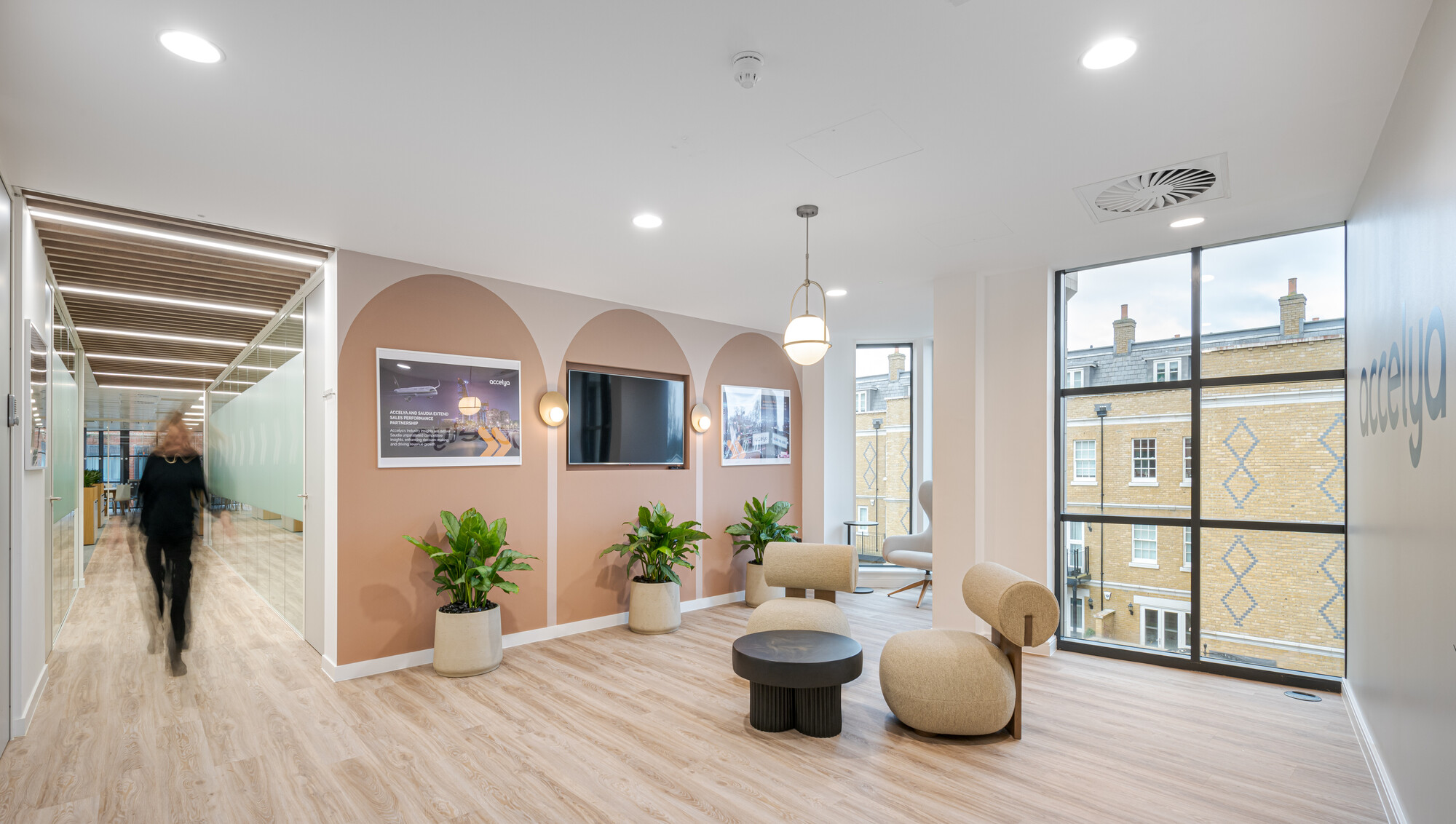 Aviation-inspired waiting area at Accelya, featuring sculptural seating, soft curves and layered tones by Platfform.
