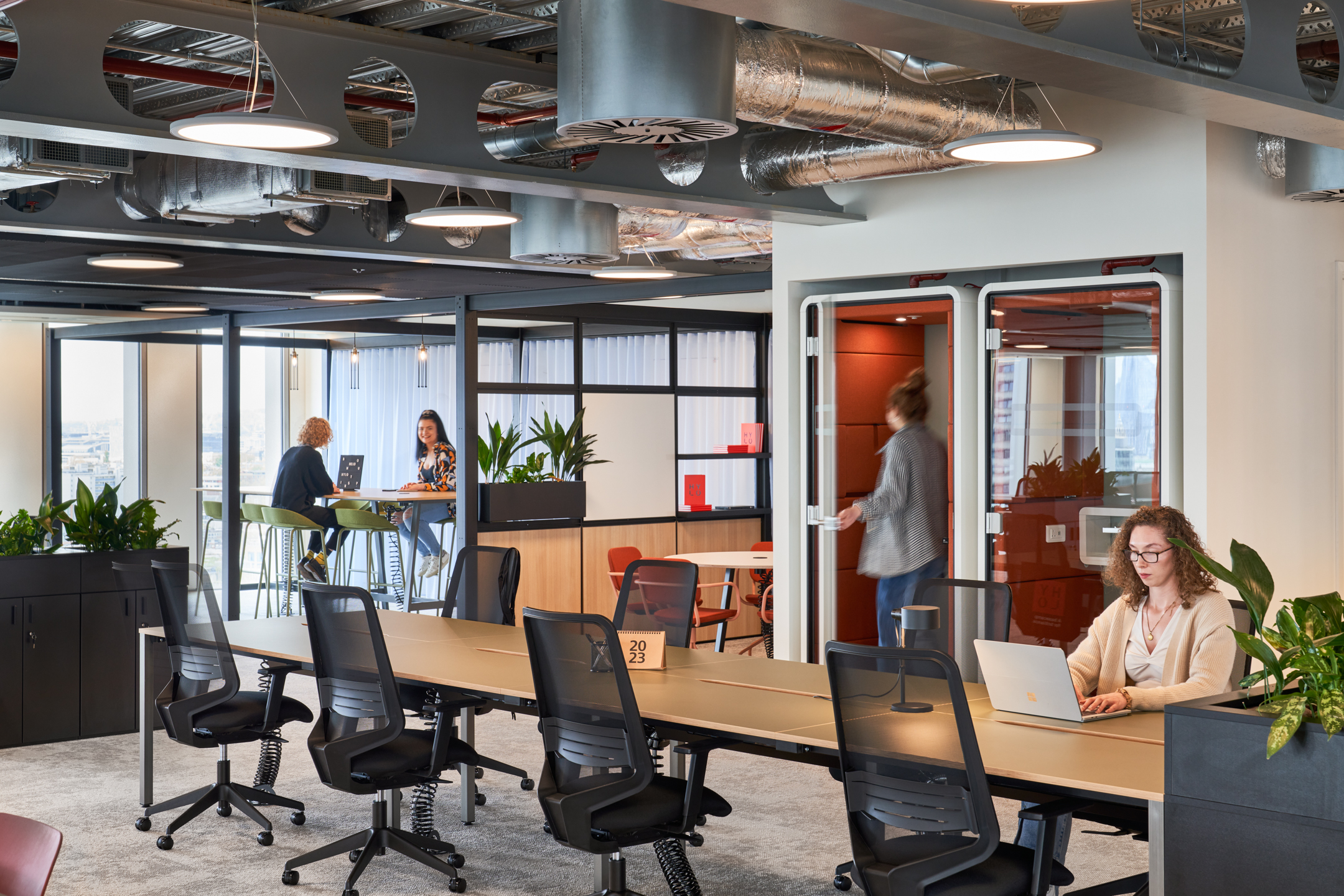 Open-plan workspace at HYLO with mesh task chairs, acoustic booths and collaborative high tables, fully furnished by Platfform.