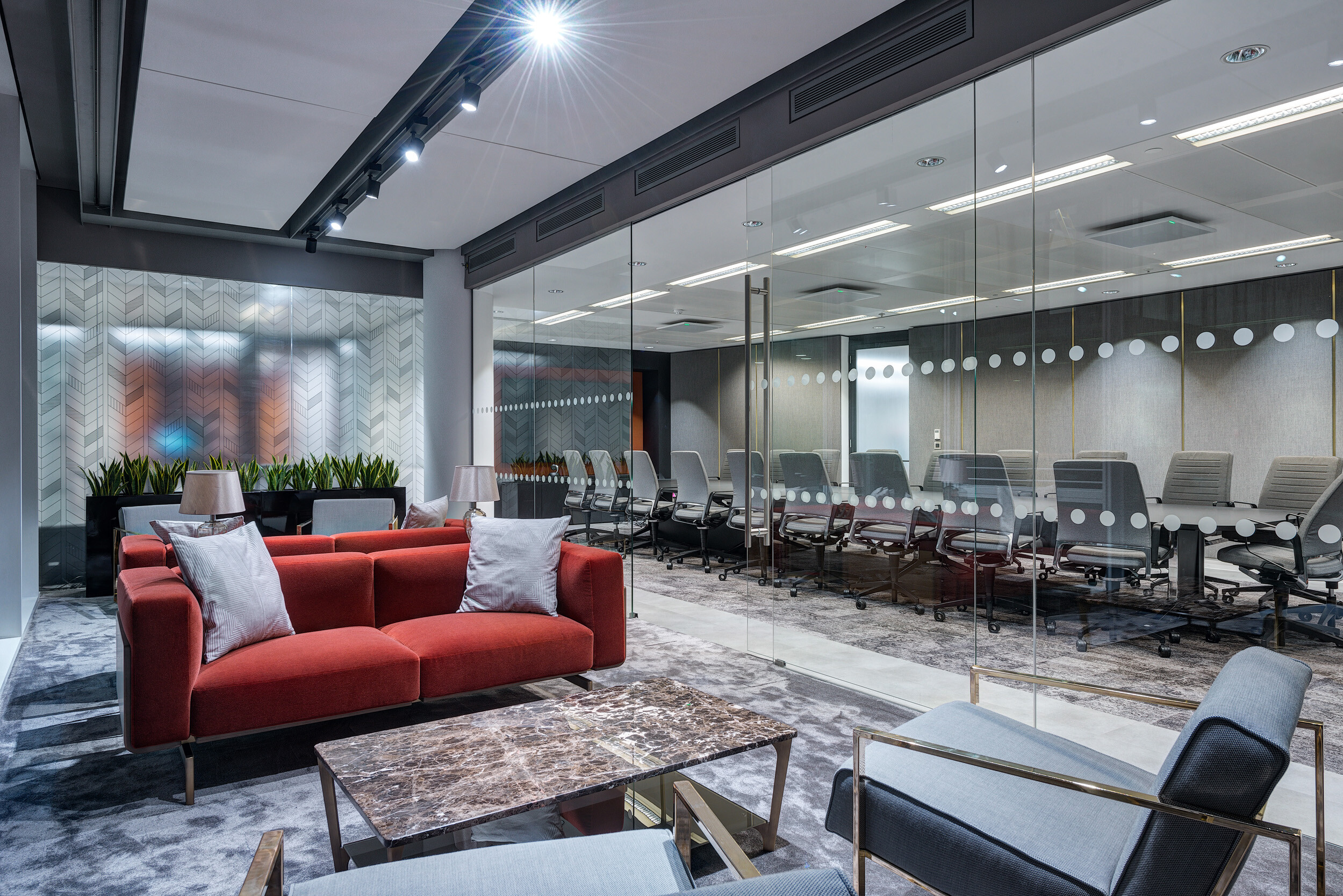 Breakout space at MITIE's Shard office, with plush seating, marble tables and ergonomic chairs curated by Platfform.