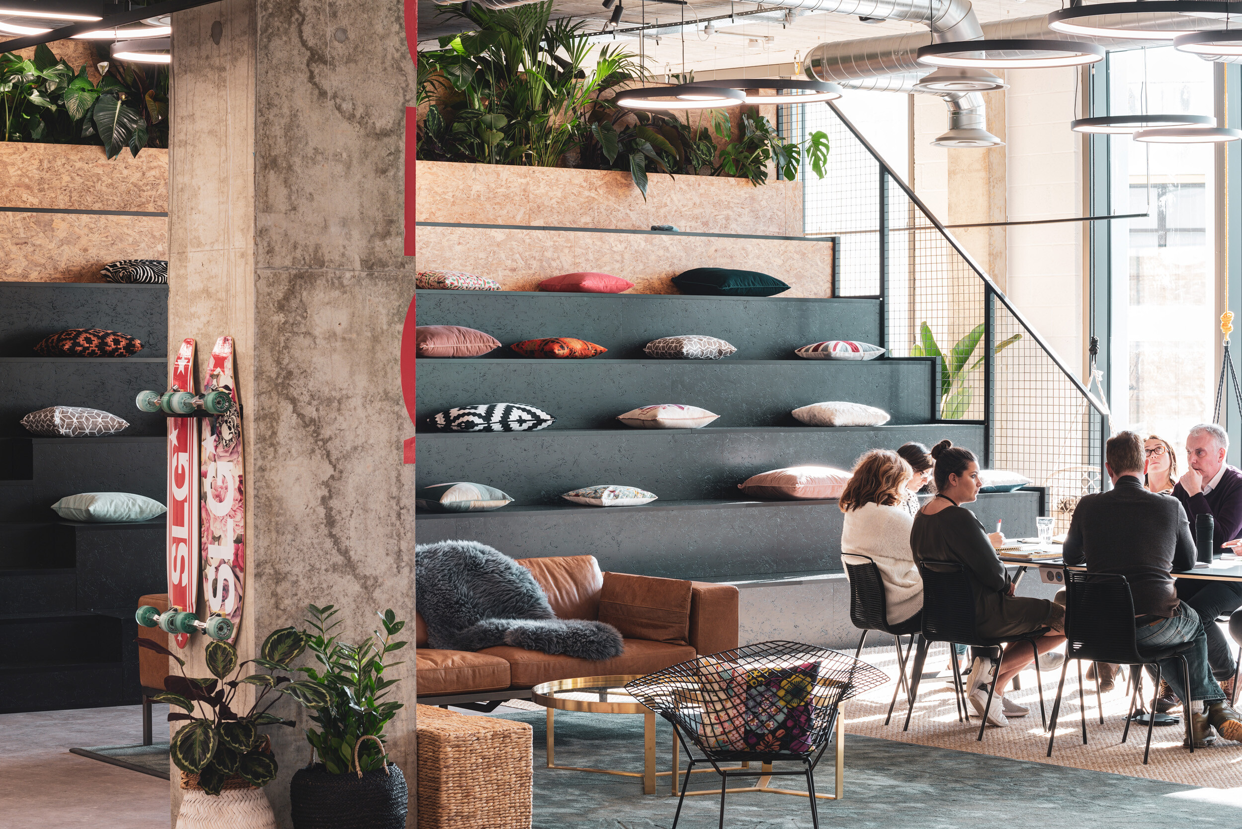 Furniture supplied for SLG’s Cheltenham HQ including tiered seating, lounge chairs and collaborative tables, supporting a creative, open layout.