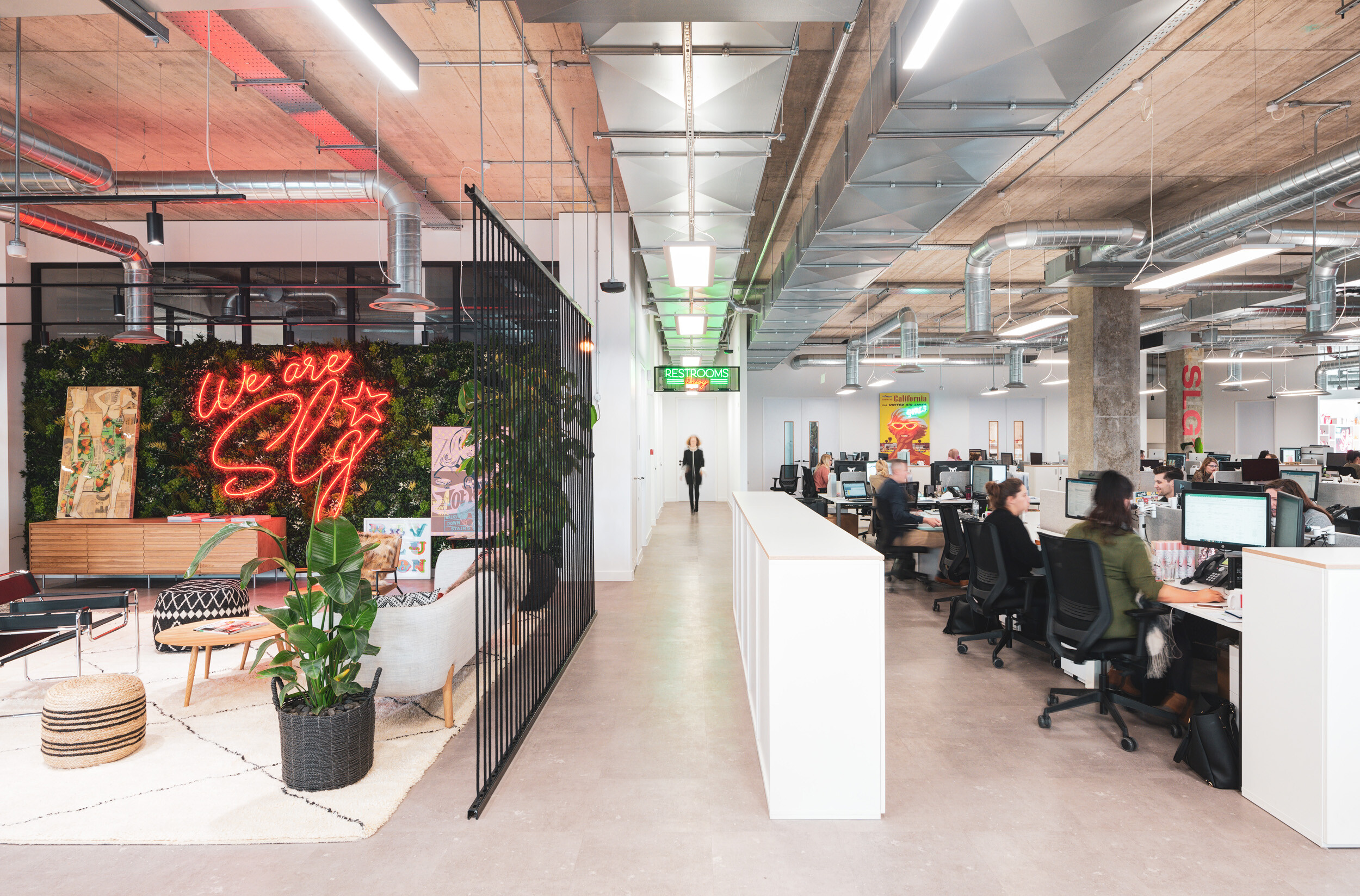 SLG’s Cheltenham HQ with a branded lounge area and open-plan desking, furnished to support collaboration and reflect the company’s creative edge.