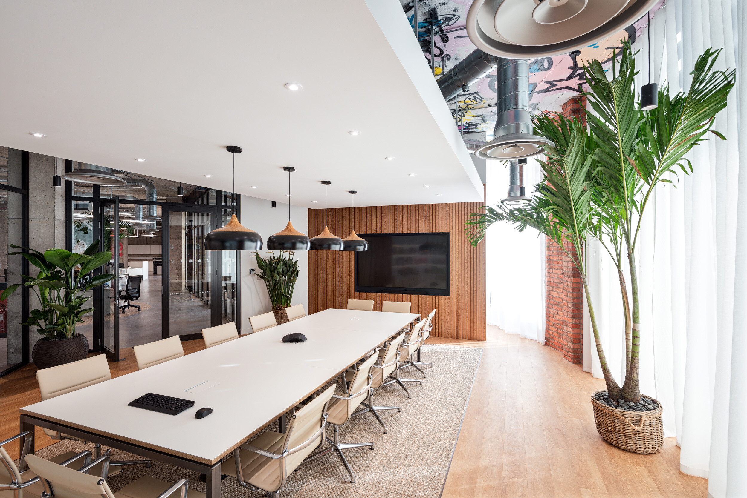 Boardroom at SLG’s Cheltenham HQ featuring a long meeting table and ergonomic chairs, furnished to support focus, comfort and collaboration.