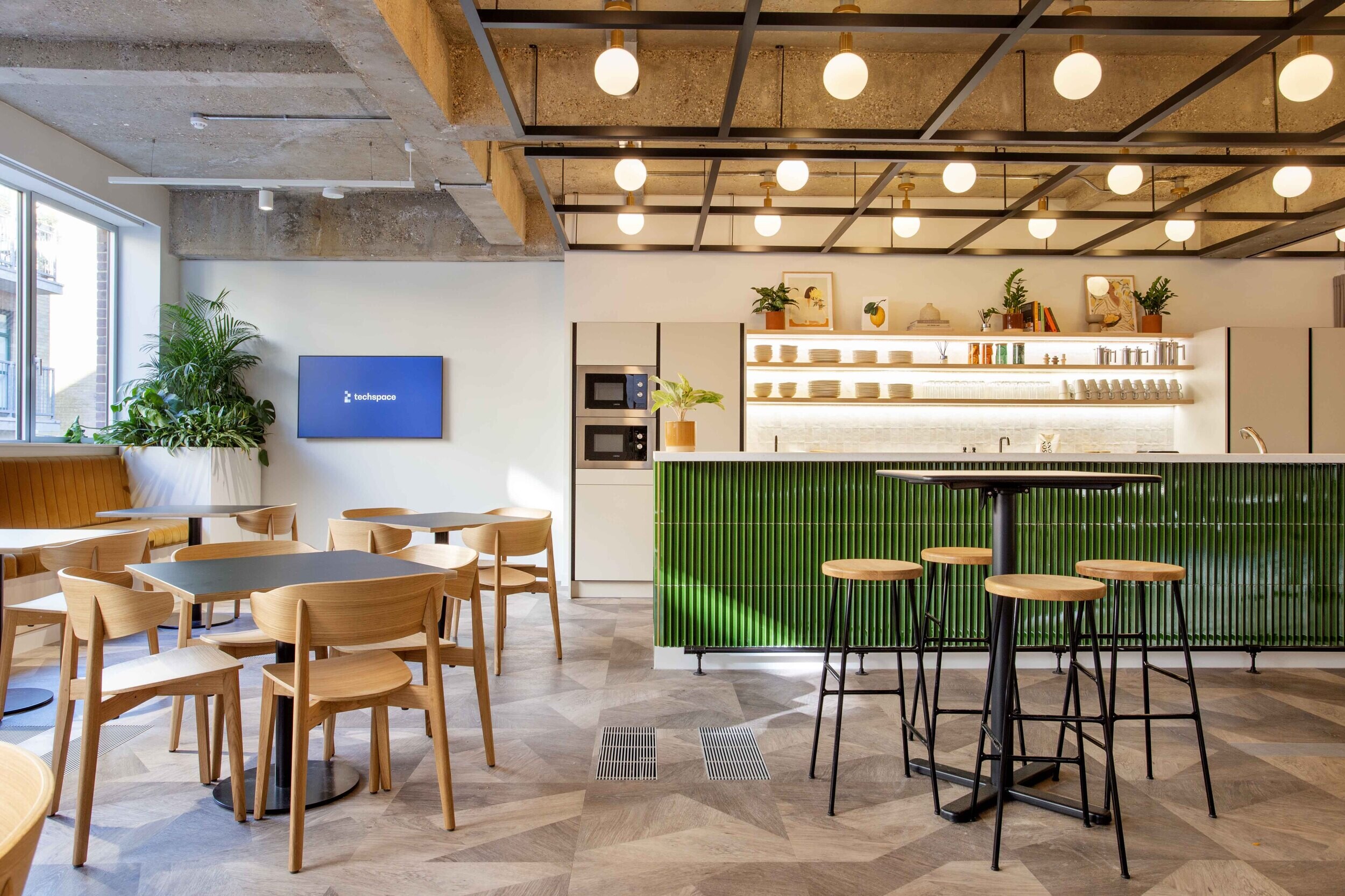 Techspace teapoint area with dining chairs and bar stools supplied for the Shoreditch office workspace