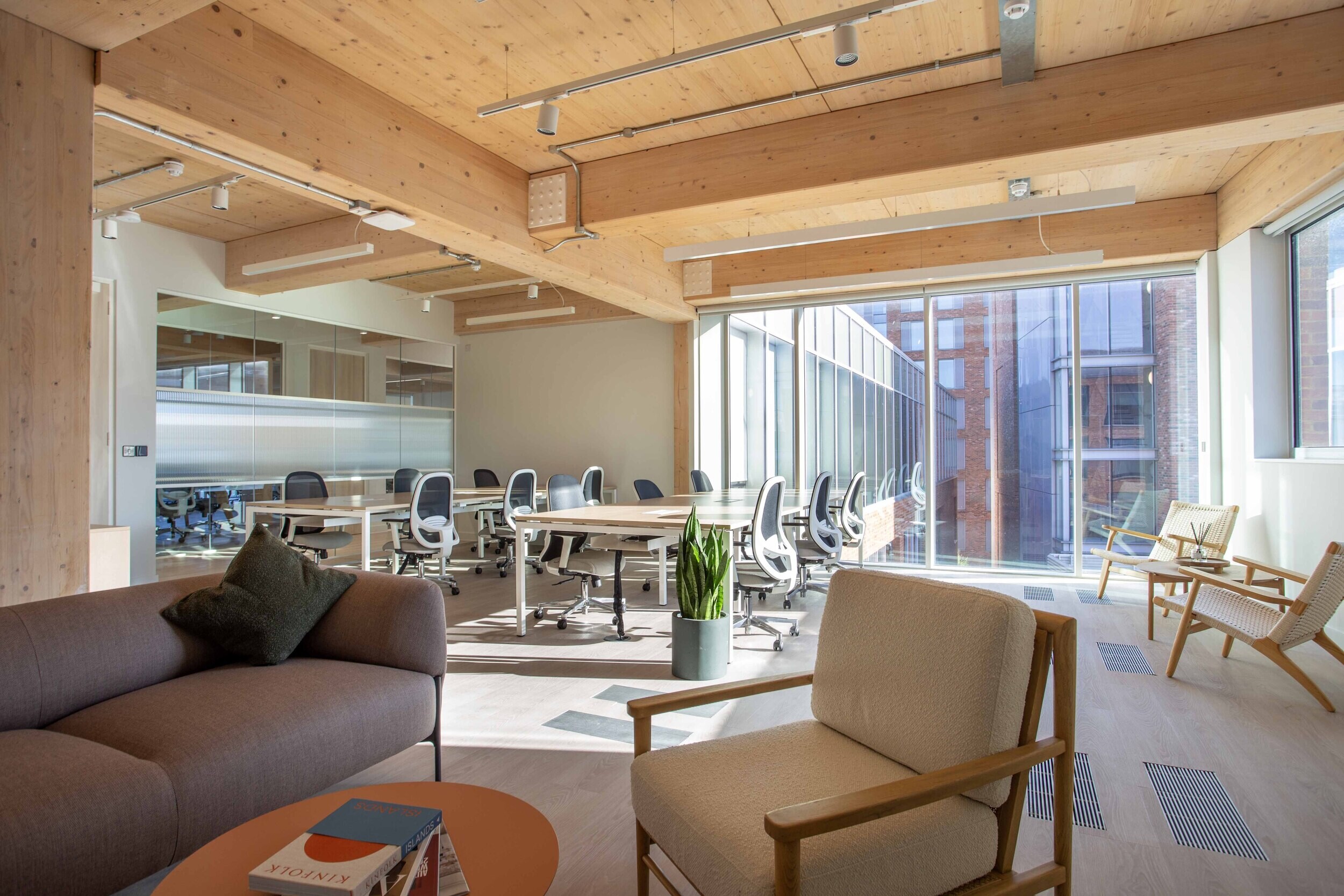 Techspace private office with task chairs desks and soft seating designed for focused work and natural light