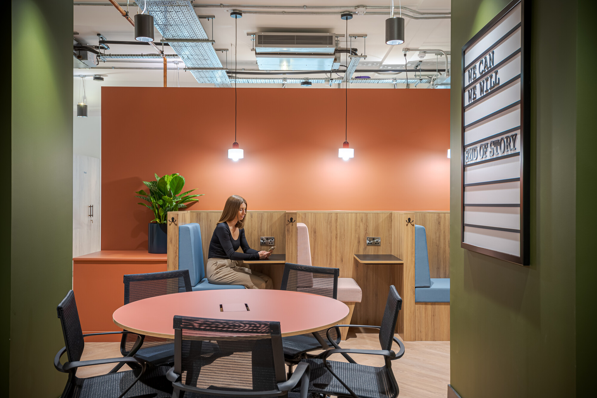 Work.Life Typewriter booth seating with tonal upholstery and integrated power, designed for quiet focus within a playful Clerkenwell setting.