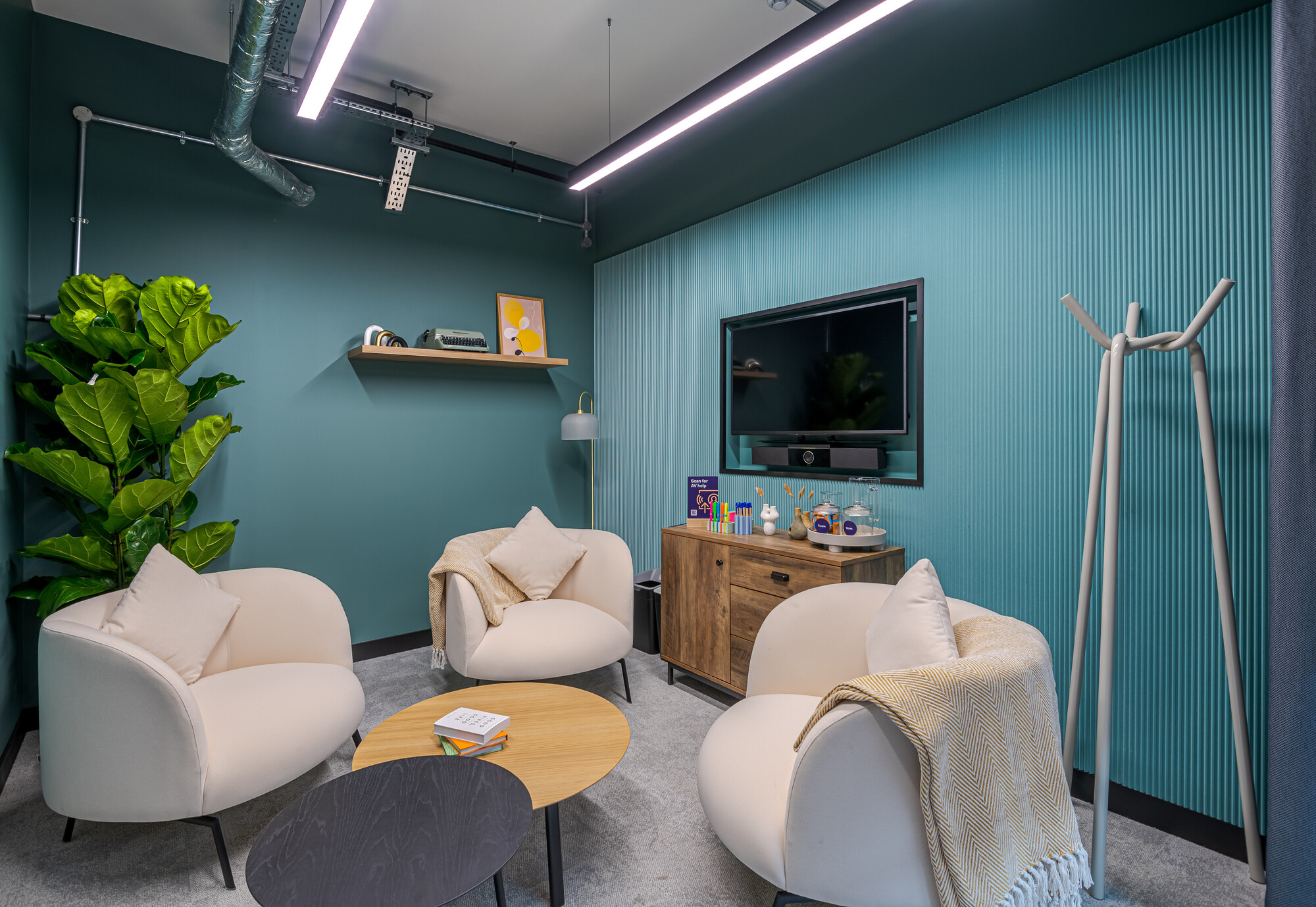 Work.Life Typewriter lounge room with soft seating, pastel tones and layered textures, designed for calm moments within a heritage workspace.