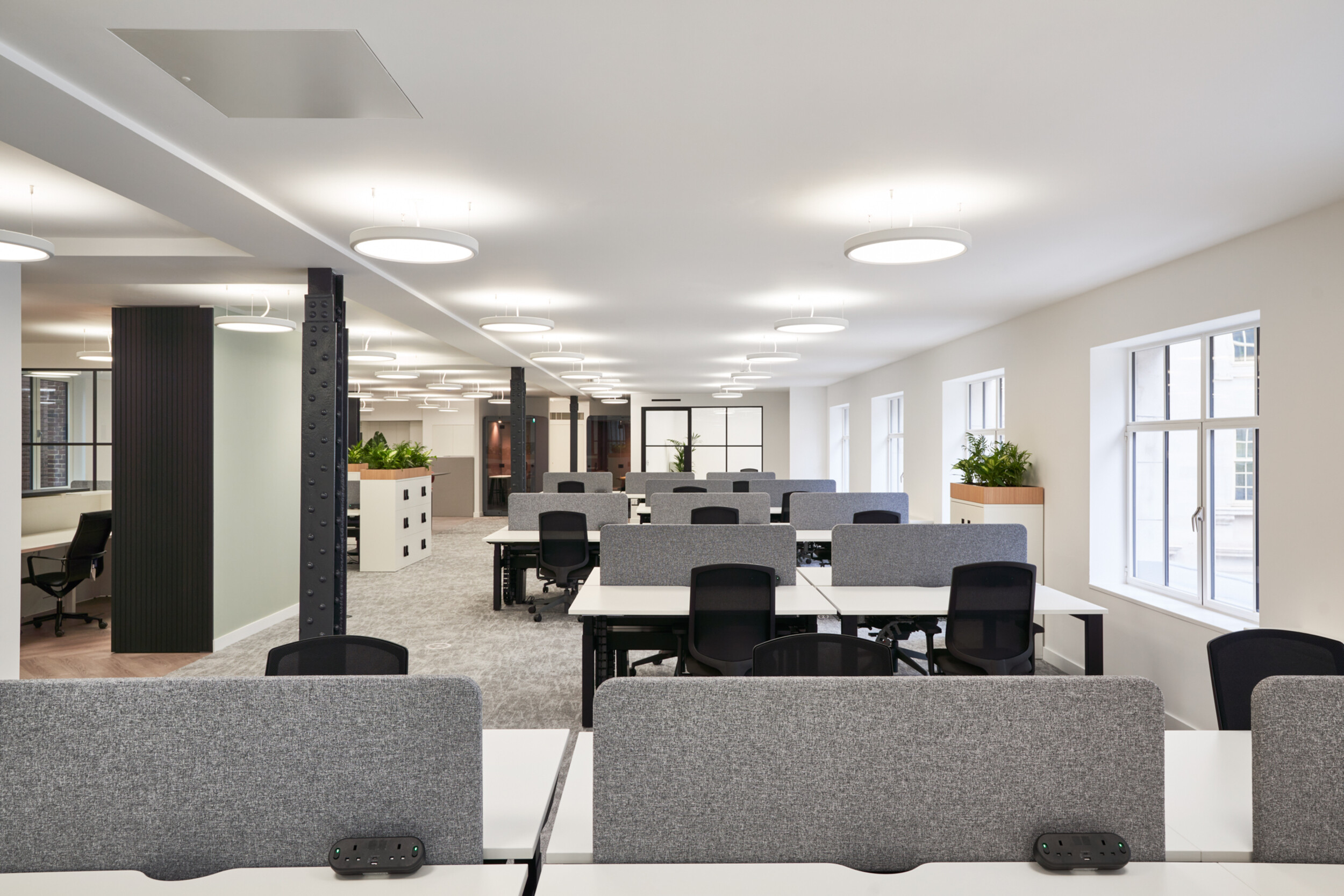 Open-plan office space at 3 St Helens Place for The Leathersellers, furnished by Platfform, with bench desking, ergonomic seating, and zoned layouts to encourage flexible working.