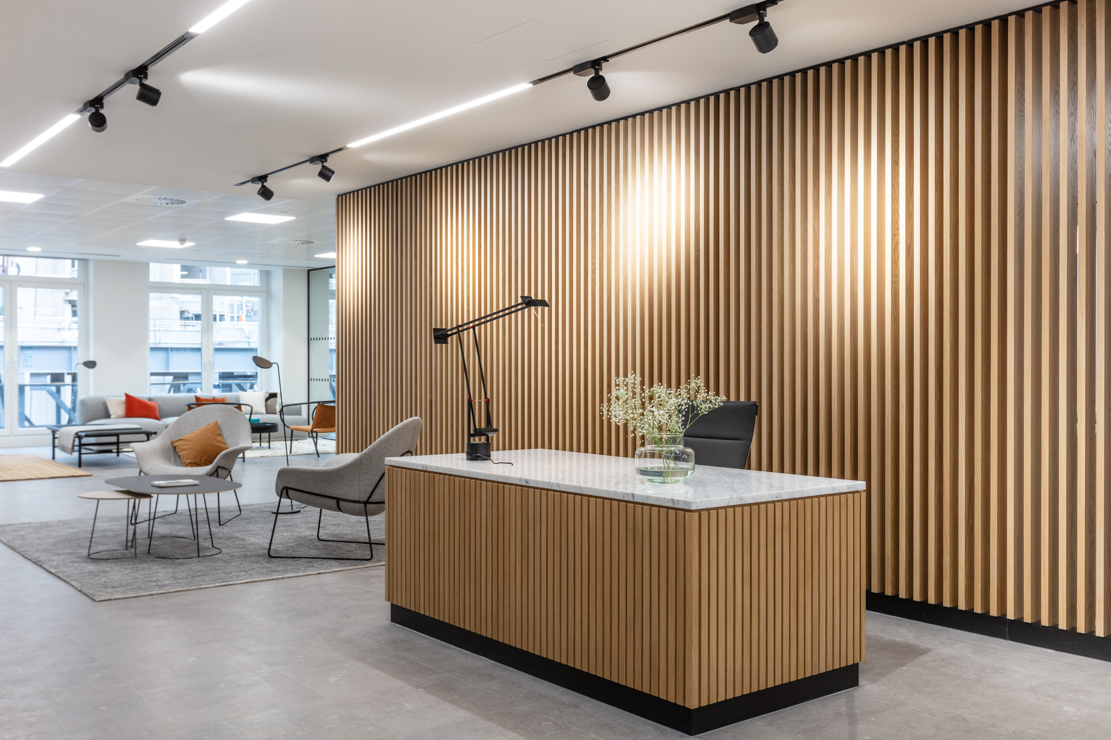 Reception area at 7 Bishopsgate Level 2 for BGO, furnished by Platfform, featuring curved joinery, soft-toned finishes, and biophilic accents that set the tone for the tenant-ready workspace.