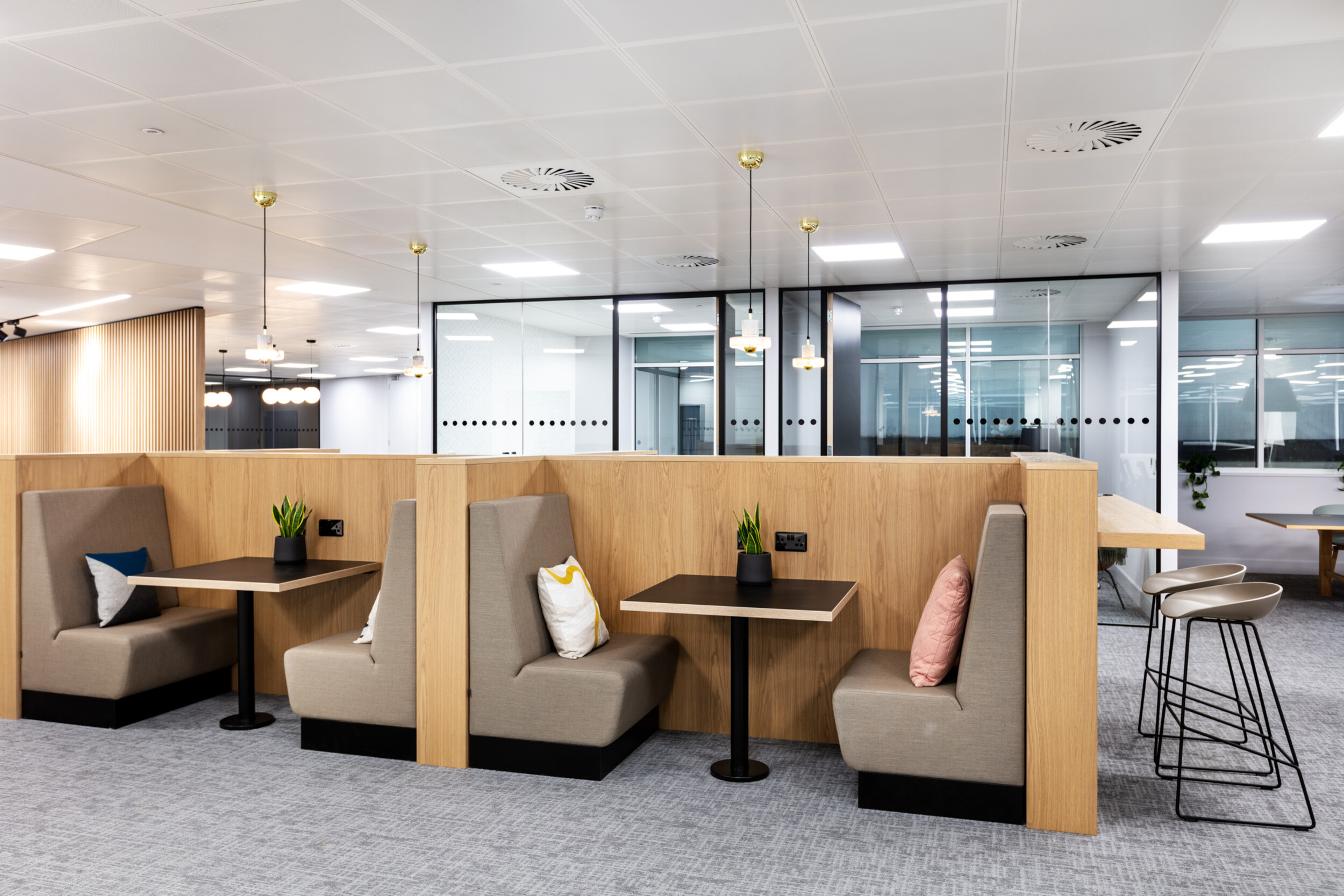 Banquet seating at 7 Bishopsgate Level 3, supplied by Platfform, combining upholstered fixed seating with inset tables to create a comfortable, space-efficient breakout setting.