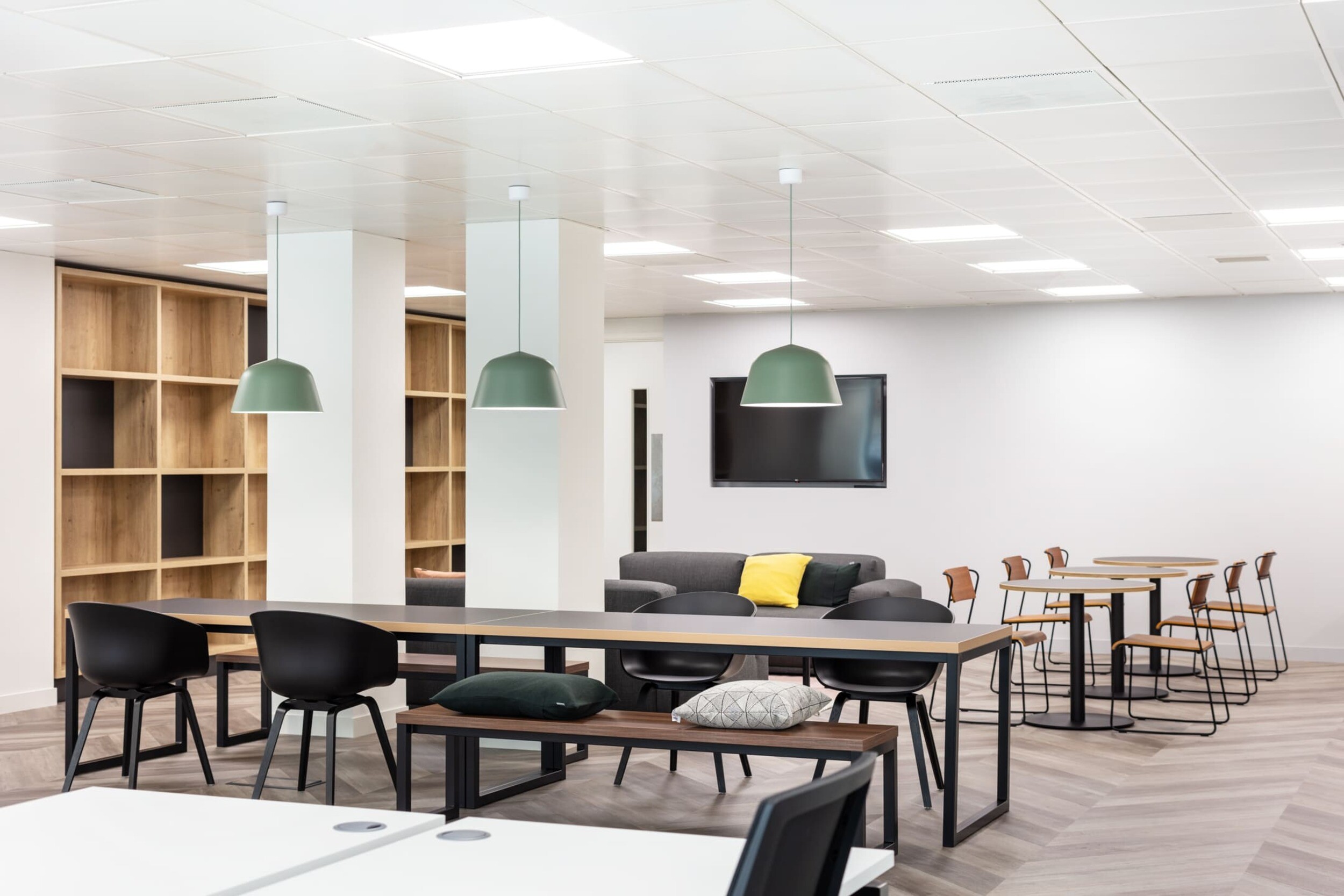 Open office space at Platfform’s Bury House project featuring desks, teapoint areas, glazed meeting rooms, and a variety of collaboration zones.