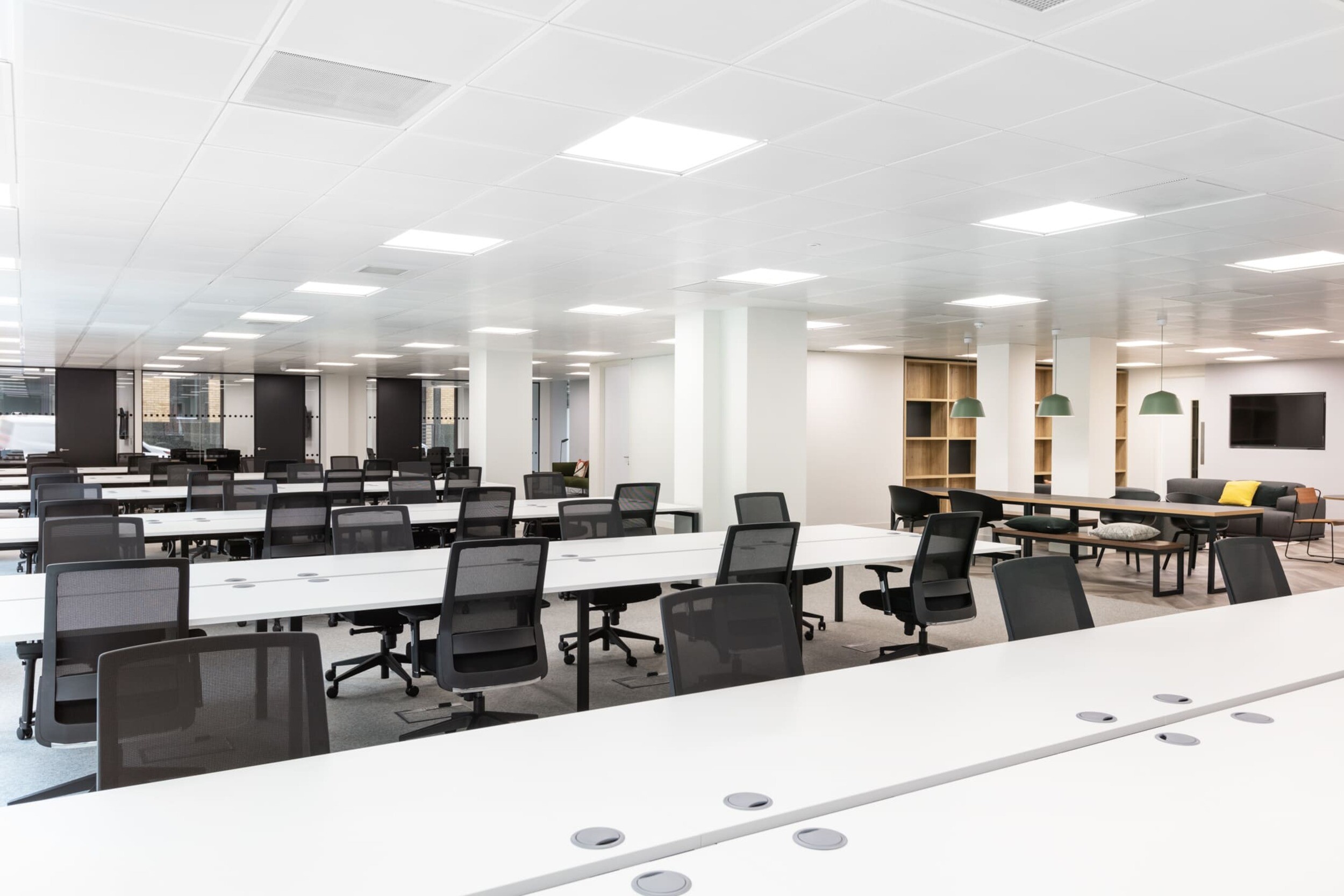 Open office space at Platfform’s Bury House project featuring desks, teapoint areas, glazed meeting rooms, and a variety of collaboration zones.