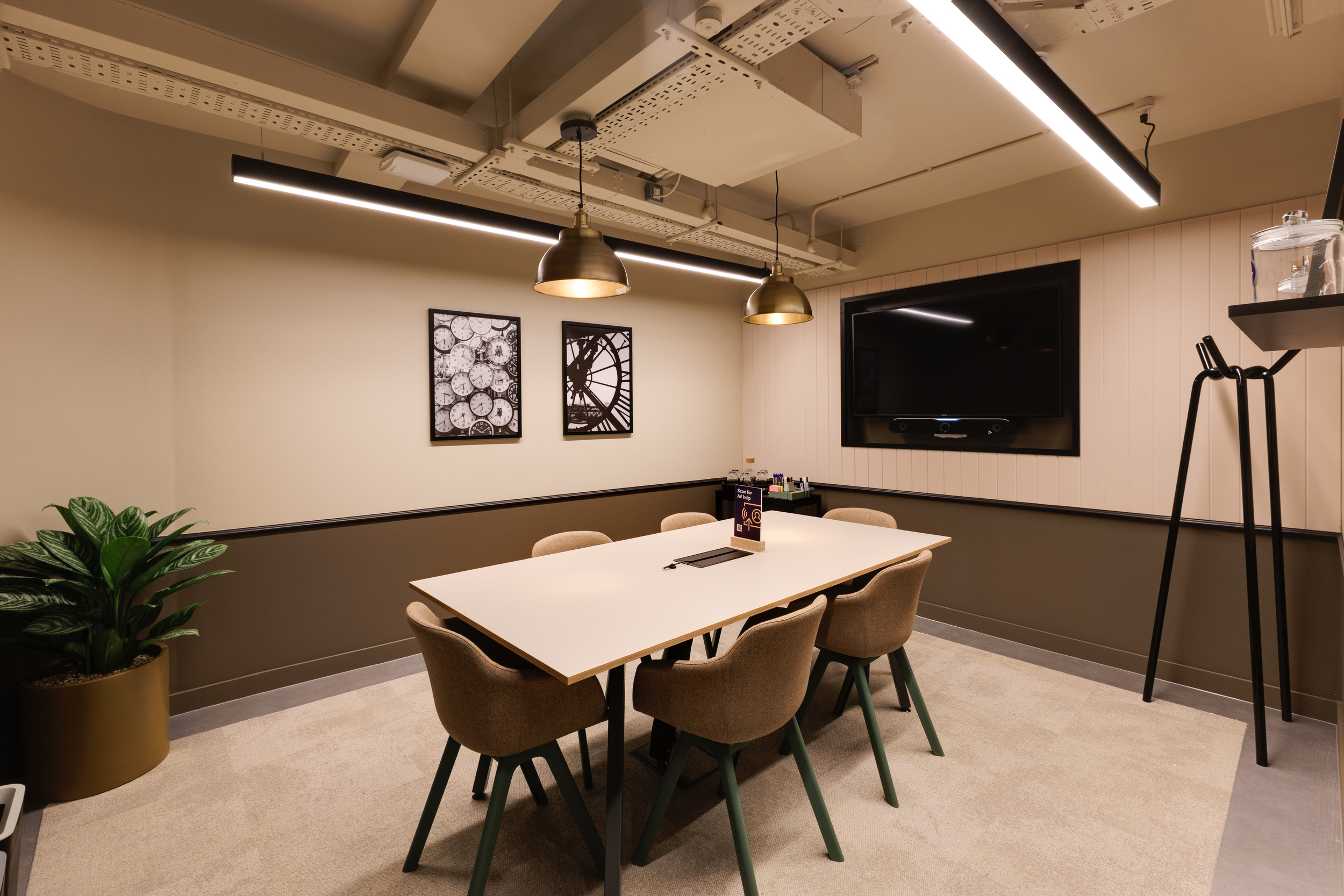 Lower ground meeting room at Work.Life Clerkenwell Green with warm lighting, neutral finishes and contemporary furniture supplied by Platfform.